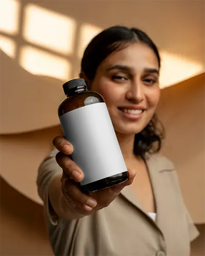 Hand Holding Clear Bottle Mockup For Product Presentation And Branding Designs