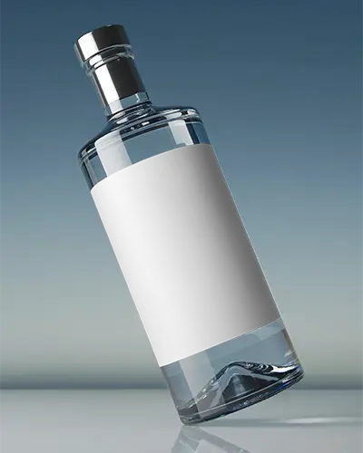 Premium Wine Glass Bottle Mockup Tilted On Reflective Surface Under Blue Sky Gradient