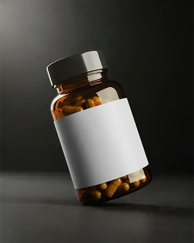 Amber Pill Bottle Mockup Angled On Dark Surface With Studio Lighting