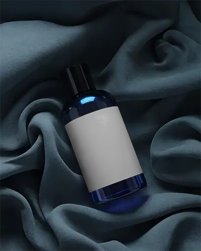 Elegant Beauty Product Bottle Mockup With Customizable Label On Smooth Draped Fabric Background