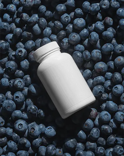 Empty Nutrition Supplement Bottle Mockup Floating Above Fresh Berry Background