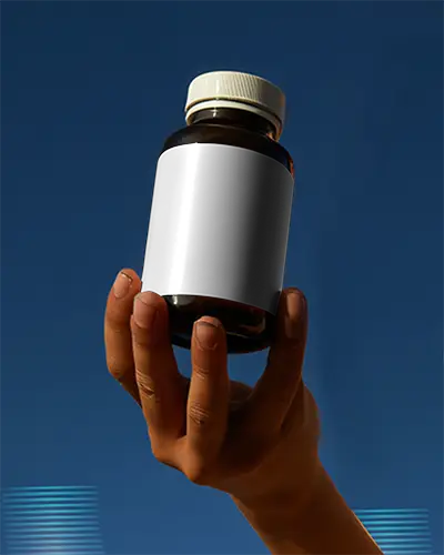 Hand Holding Frosted Glass Bottle Mockup For Supplement Packaging Design Presentation