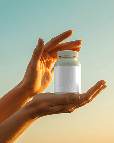 Human Hands Presenting Pharmaceutical Bottle Mockup With Clear Label Space For Custom Branding