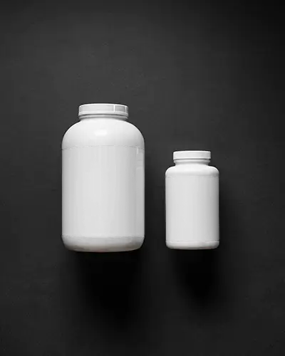 Dual Size Supplement Bottle Mockups With Blank Labels For Healthcare Packaging Design