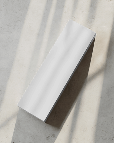 White Rectangular Box Mockup On Concrete Floor With Soft Sunlight And Shadow Lines Minimal Top View