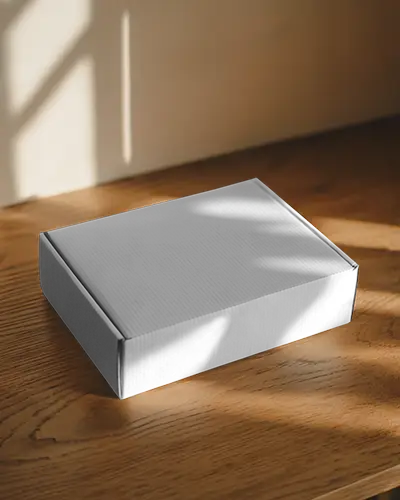 Rectangular Packaging Box Mockup On Wooden Table In Natural Sunlight With Shadows