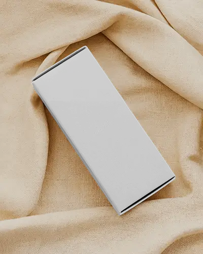 Rectangular Box Mockup Resting On Wrinkled Beige Cloth Top Angle Soft Light