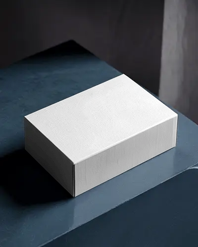 High End Textured Box Mockup On Blue Stone Surface With Matte Lighting And Subtle Contrast