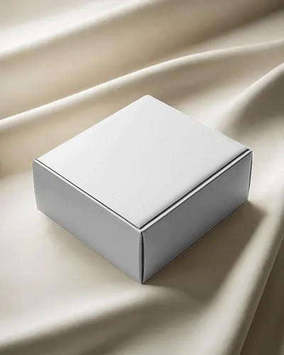 Luxury Square Box Mockup Placed On Cream Silk Fabric Soft Shadows And Premium Lighting Aesthetic