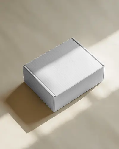 Angled Cardboard Box Mockup In Soft Daylight Casting Clean Shadows On Minimal Beige Background