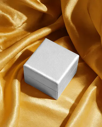 luxury-small-box-mockup-on-yellow-satin-fabric-soft-light-jewelry-display-packaging-scene