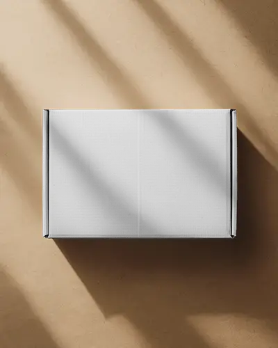 top-view-cardboard-box-mockup-with-dramatic-light-and-shadow-on-brown-surface