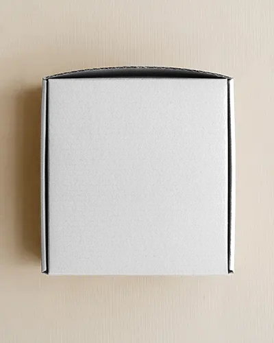 top-view-square-box-mockup-minimal-flat-lay-on-neutral-textured-surface-modern-look