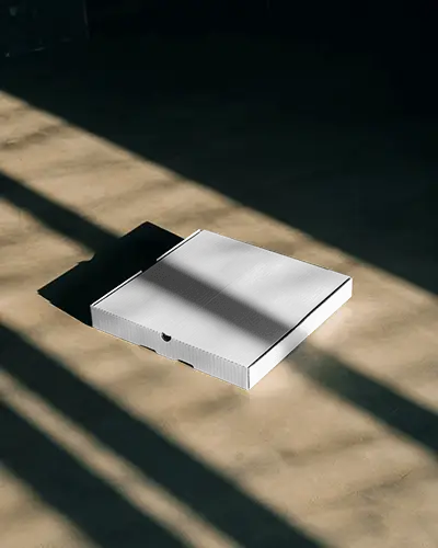 shadow-lit-flat-pizza-box-mockup-on-minimal-floor-with-dramatic-light-and-clean-modern-style