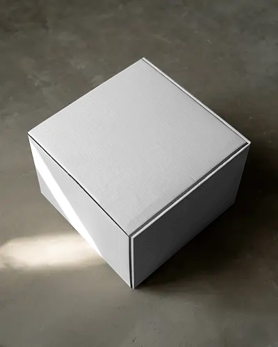square-cardboard-box-mockup-on-stone-floor-with-soft-natural-lighting-minimal-elegance