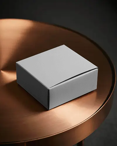 sleek-square-box-mockup-on-metallic-copper-table-modern-luxury-packaging-display