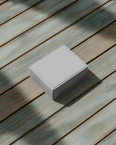mailer-box-mockup-on-weathered-wooden-deck-with-natural-lighting-and-shadows