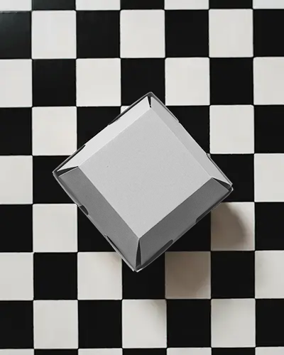 checkered-floor-black-box-mockup-top-view-minimal-modern-packaging-display