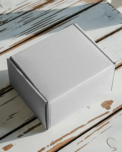 Cardboard Box Mockup On Weathered Wooden Surface With Natural Daylight Shadows