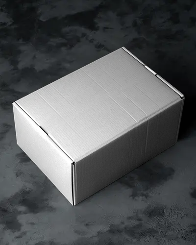 Matte Cardboard Box Mockup On Dark Stone Surface With Dramatic Lighting For Elegant Packaging