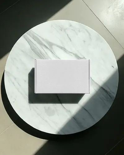 rectangular-box-mockup-on-round-marble-table-with-sunlight-for-luxury-packaging-display