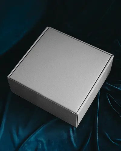 square-box-mockup-on-dark-blue-velvet-surface-for-premium-ecommerce-packaging-design