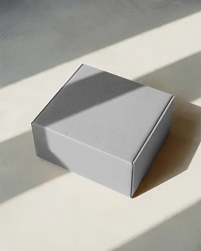 square-cardboard-box-mockup-on-beige-surface-with-soft-shadows-for-minimalist-style