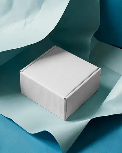 small-cardboard-box-mockup-on-blue-paper-sheets-for-stylish-minimal-brand-packaging