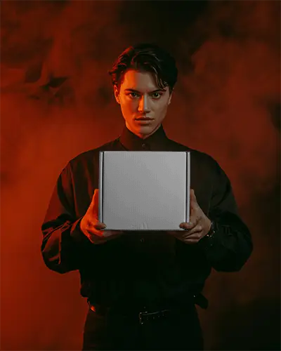 Person Holding Square Packaging Box Mockup For Ecommerce Shipping And Brand Presentation