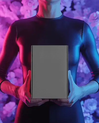 Sleek Box Mockup Held By Person With Vibrant Backdrop Showcased In Modern Setting