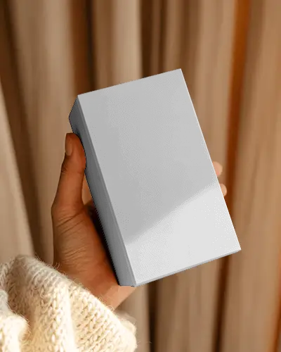 Warm Cozy Handheld Box Mockup With Soft Knit Sleeve And Gentle Natural Curtain Backdrop