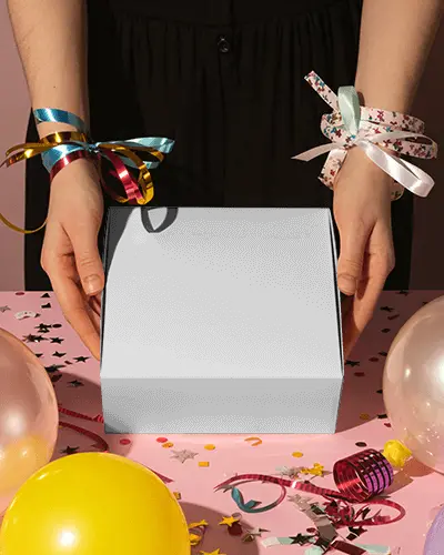 Vibrant Party Celebration Box Mockup With Colorful Ribbons Balloons And Confetti Filled Tabletop