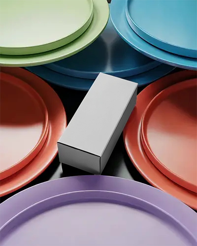 Sleek Modern Box Mockup Placed Among Round Dinner Plates For Stylish Brand Presentation