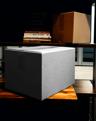 Corrugated Box Mockup Below Book Shelf