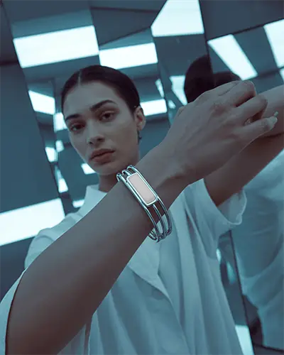 Futuristic Silver Bracelet Mockup On Model In Mirrored Room With Cool Blue Light