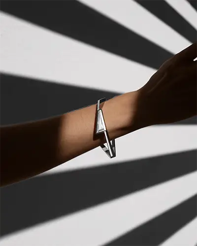 Modern Geometric Silver Bracelet Mockup On Arm With Bold Striped Shadow Pattern