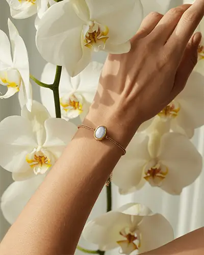 Delicate Gold Bracelet Mockup Among Blooming White Orchids In Soft Natural Light