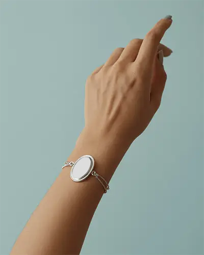 Minimal Silver Bracelet Mockup On Elegant Female Hand Against Soft Pastel Background