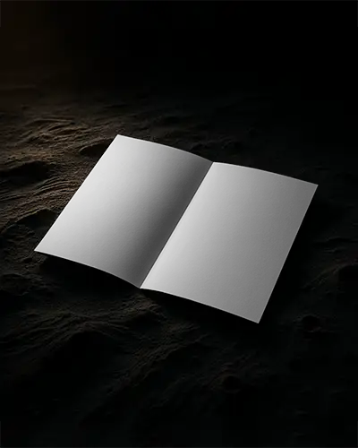 Luxury Brochure Mockup Open On Dark Cratered Surface With Dramatic Lighting
