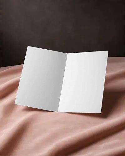 Open Brochure Mockup On Soft Pink Fabric With Rich Dark Background