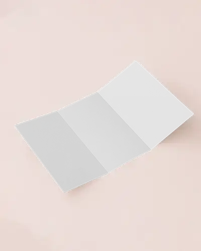 Open Trifold Brochure Mockup On Blush Pink Surface Soft Lighting With Subtle Paper Texture