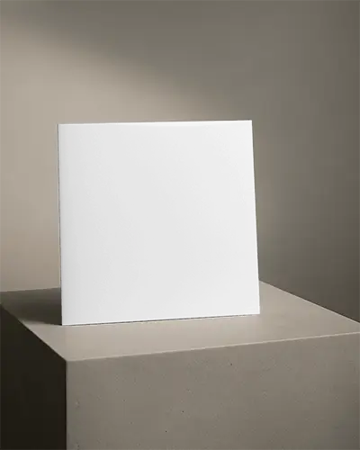 Square Brochure Mockup Standing On Concrete Pedestal In Soft Natural Light With Neutral Wall Background Clean Minimalistic Blank Presentation For Modern Branding