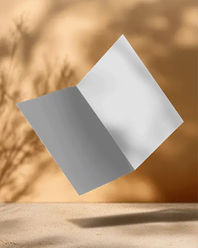 premium-quality-folded-brochure-mockup-template-floating-over-natural-beach-sand-texture