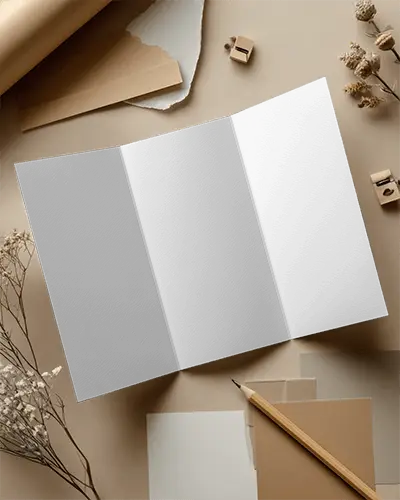 trifold-brochure-mockup-on-minimalist-workspace-for-design-presentation