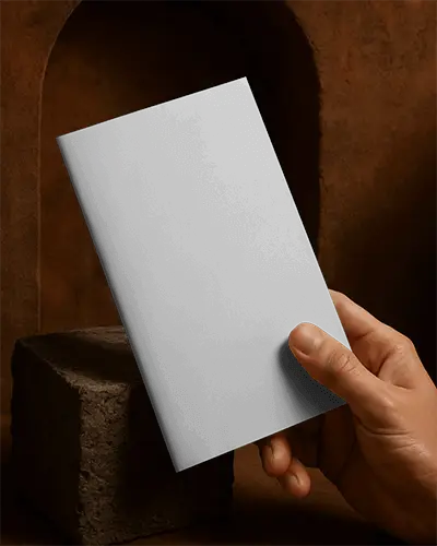 Hand Holding Minimalist Brochure Mockup On Textured Surface For Design Presentation