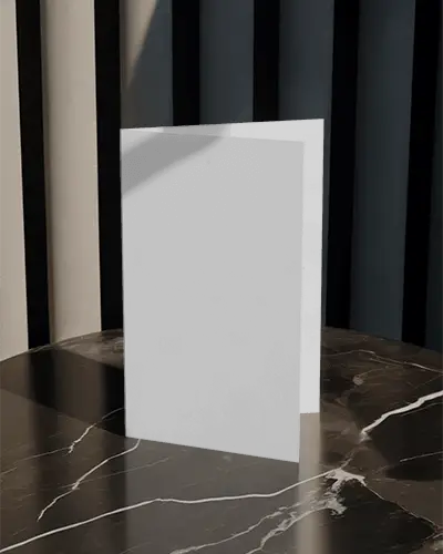 minimalist-folded-brochure-mockup-centered-on-reflective-marble-table-with-dark-curtain