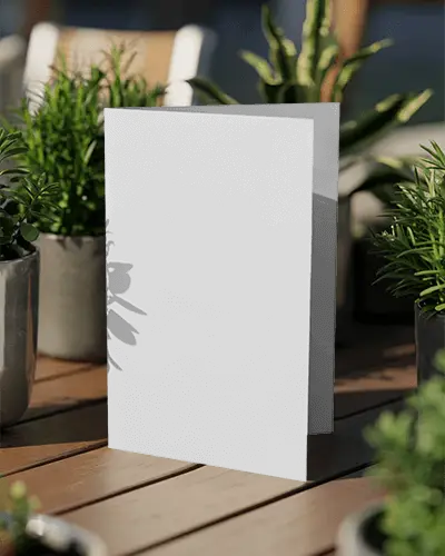blank-folded-brochure-mockup-placed-on-wooden-table-with-natural-plant-background