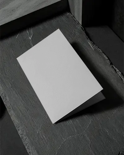 Elegant Bifolded Brochure Mockup Placed On Rough Textured Stone Background