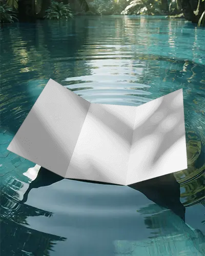 realistic-trifold-brochure-mockup-floating-on-smooth-water-with-reflection-and-greenery