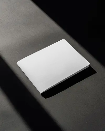 elegant-brochure-mockup-on-dark-grey-background-highlighted-by-angled-light